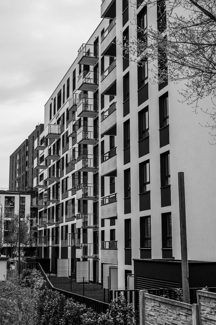 about-01 Contemporary apartment buildings captured in black and white, showcasing urban architecture.